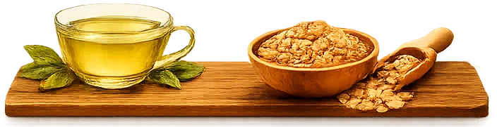 A glass of green tea and a bowl of oats